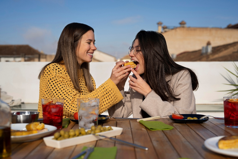 Two girls eating Greek food in Chicago